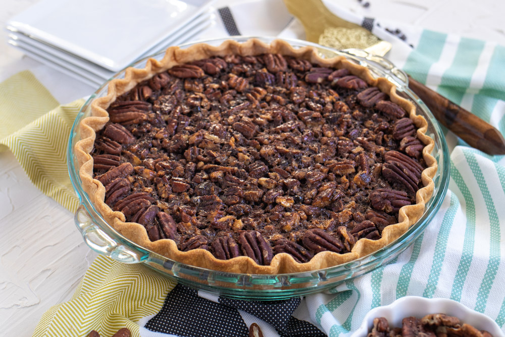 Why settle for a store-bought, classic pecan pie when you can easily make this homemade Chocolate Pecan Pie instead? The chocolate, brown sugar, and corn syrup lend plenty of sweetness to the pecan pie filling. You'll find that a small slice is all you need to satisfy your sweet tooth!
