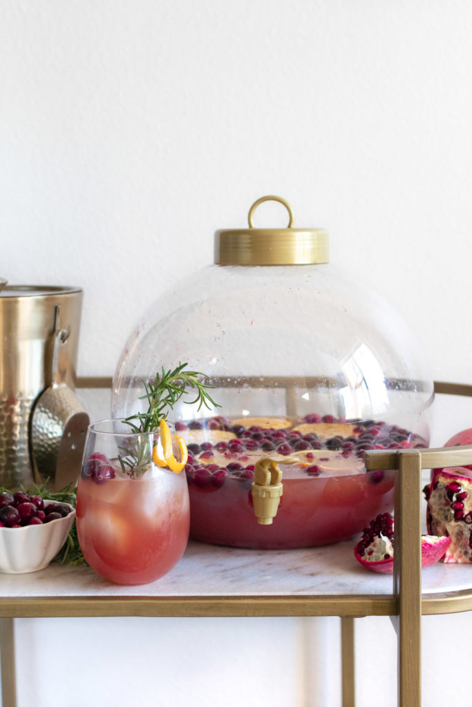 Savor seasonal flavors and ring in the new year with this Spiked Seltzer Holiday Punch! This rum-based cocktail combines trendy spiked seltzer with cranberry juice and orange juice. Garnish with fresh pomegranate seeds and citrus for a festive flair!